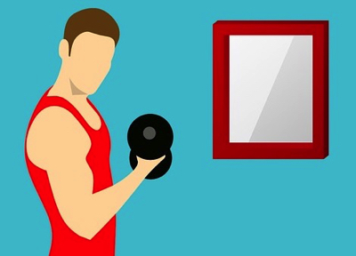 ダンベルで筋トレする男性